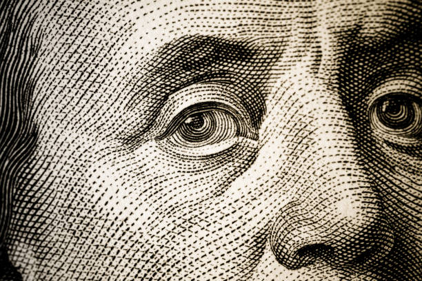 istock Portrait of Benjamin Franklin macro, a hundred dollars. 1268529690