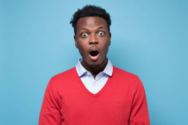 istock Handsome african man looking in shock and frustration at the camera 1268539008