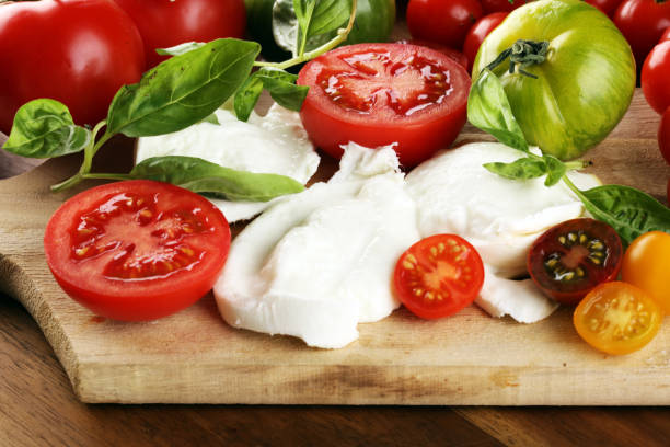 istock Caprese salad with tomatoes, fresh mozzarella and basil. 1268548433