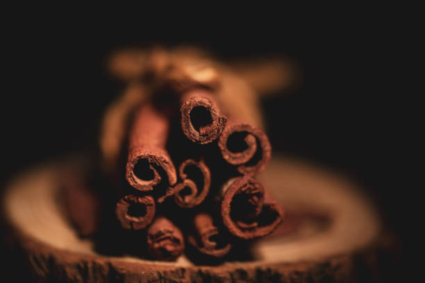 cinnamon sticks on a wooden plank