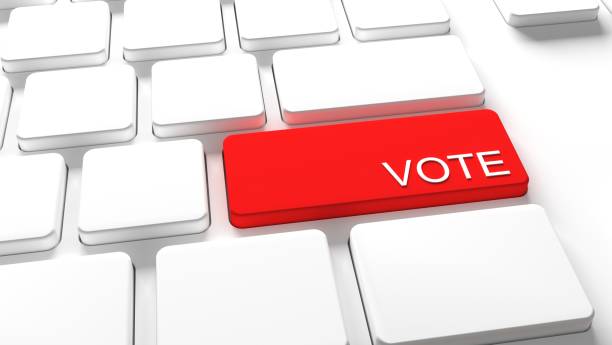 istock Vote Keyboard button - Electronic or internet voting concept (e-voting or online voting) American Election 1268548753
