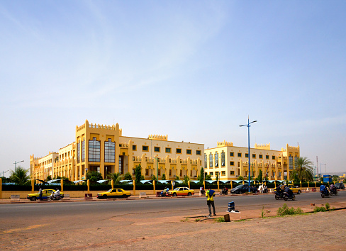 Bamako, Mali: buildings of the Malian government HQ, the Administrative City - Cité Administrative, Primature - Traffic on the Airport Road, NE side of the government compound. Sahel region architecture.