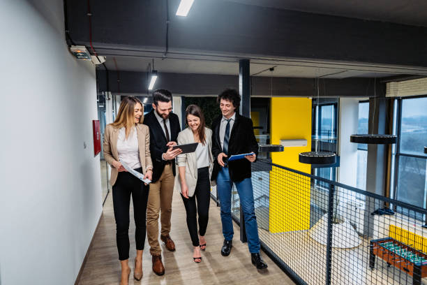istock Businesspeople having a meeting in hallway 1268557044