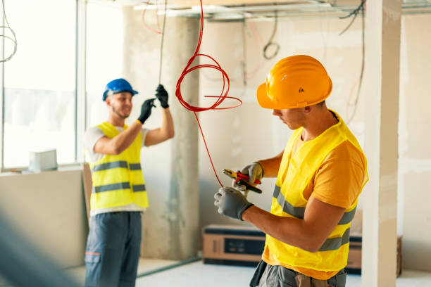 istock Electrician and colleaguen checking wiring 1268559474