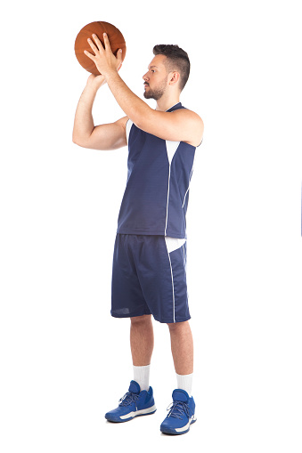 Man in blue jersey playing basketball, isolated on white background