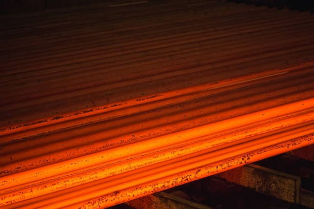 istock Hot square steel bloom on the roll-table. 1268560016