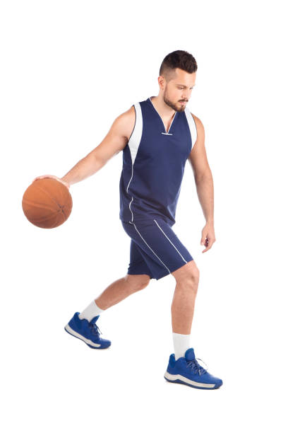 istock Man in blue jersey playing basketball 1268560039