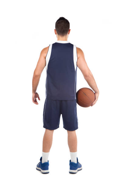 istock Man in blue jersey playing basketball 1268560170