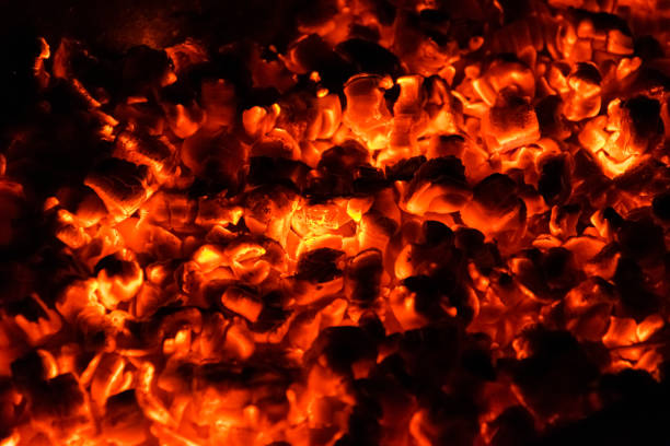 istock Hot and burning coals in a brazier at night. 1268560740