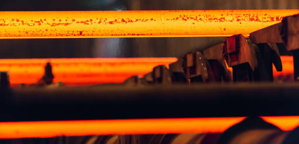 istock Hot square steel bloom on the roll-table. 1268560786