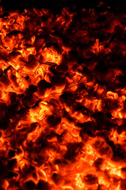 istock Hot and burning coals in a brazier at night. 1268560792