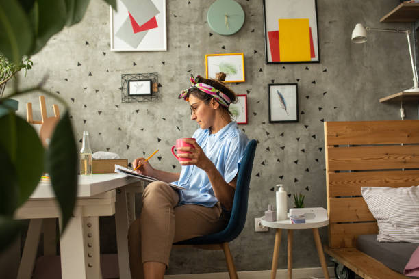 istock Woman enjoying drawing at home during weekend 1268564082