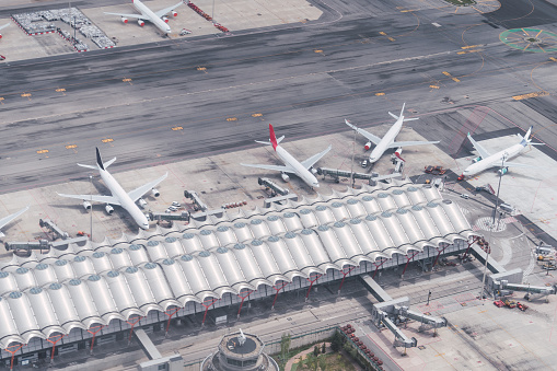 Aerial view of one of the terminals of Adolfo suarez airport in Madrid with several passengers planes attached to it. Travel. Famous place.