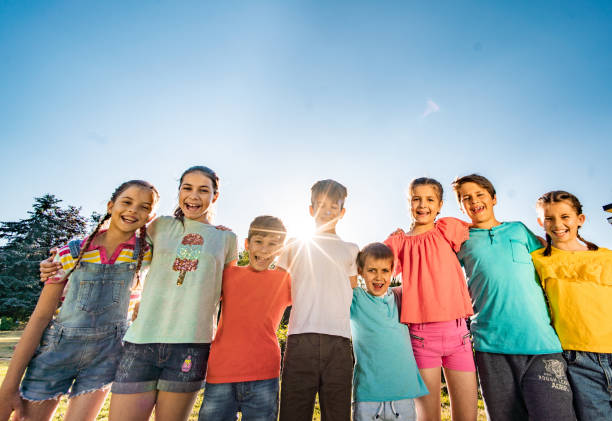 istock Group of happy children standing together 1268566708