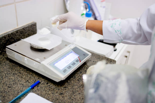 istock Pharmacist working in a laboratory preparing chemical composts 1268568579