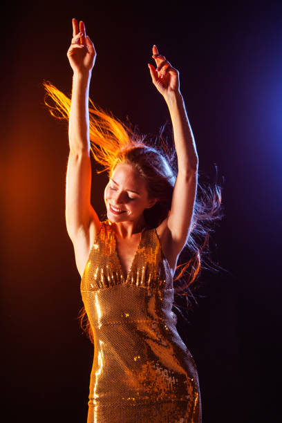 istock Dancing girl on disco party 1268569020