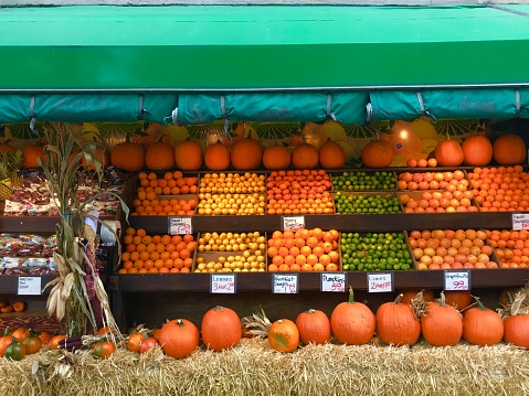 Pumpkins and produce for sale at local deli in Upper West Side, New York City.