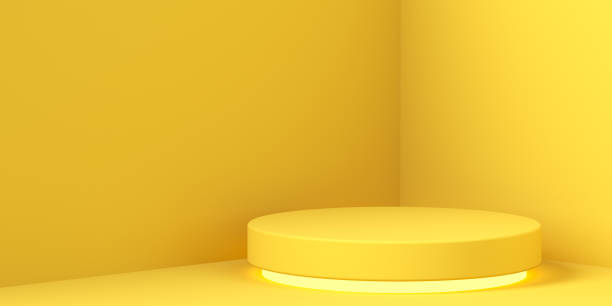 istock minimalism, simple yellow background with pedestal, copyspace 1268571053