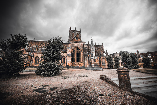 Dark Sky And View Of Gothic Church In Sherborne, UK