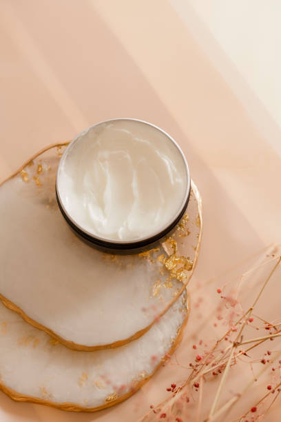 istock Cosmetic cream texture in a jar on pastel background 1268573505