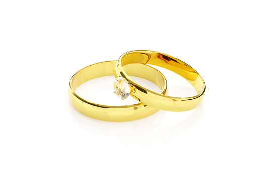 Pair of gold and diamond wedding rings isolated on white background. 3d illustration.