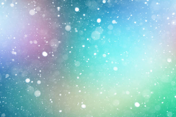 istock Winter White Falling Snow Over Blurred Defocused Colors Abstract Background for Christmas and New Years Holiday Season 1268583258