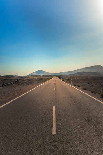 Narrow paved road for cars, part of a modern paved expressway for motor vehicles