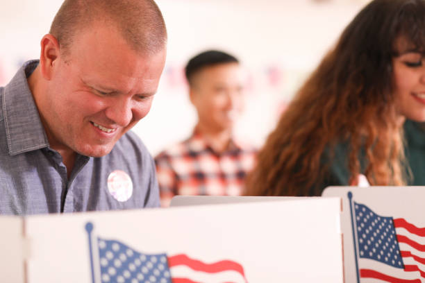 istock Mature adult man votes in USA election. 1268583842