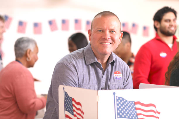 istock Mature adult man votes in USA election. 1268584372