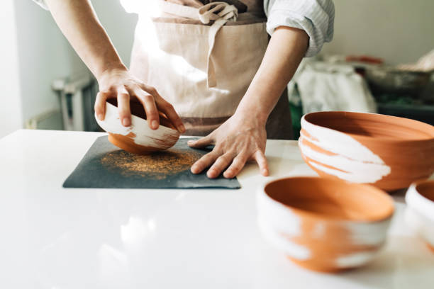 istock A Woman Potter Making Clay Bowls 1268585351