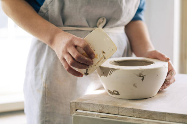 istock Woman Artisan Making Ceramics 1268585392