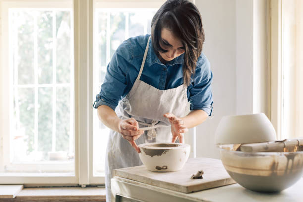 istock Woman Artisan Making Ceramics 1268585397