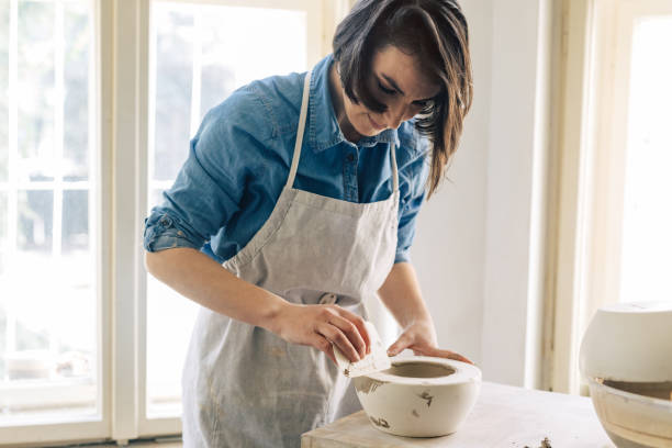 istock Woman Artisan Making Ceramics 1268585399