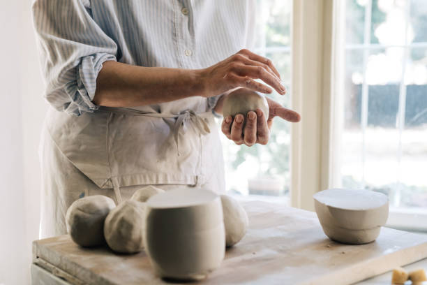 istock A Woman Molding Clay 1268585412