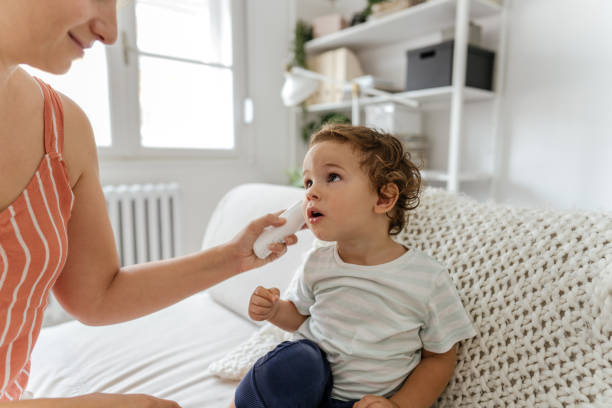 istock Body temperature check with an ear thermometer 1268588866