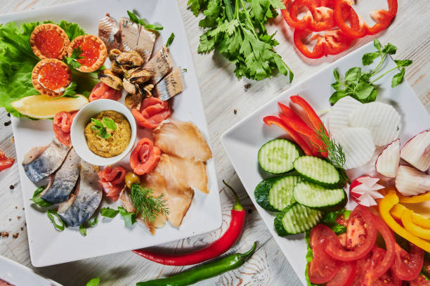 istock Dinner table with meat grill, roast new potatoes, vegetables, salads, sauces, snacks and lemonade, top view. 1268592407