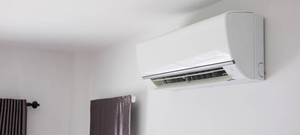 istock Air conditioner on white wall room interior background 1268593107