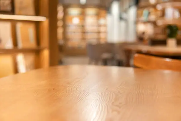 Photo of A desk beside bookshelves in a bookstore