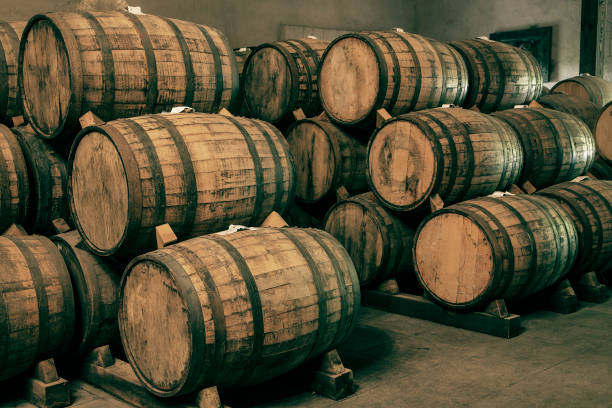 istock Wine barrels stacked in the old cellar of the winery. 1268604700