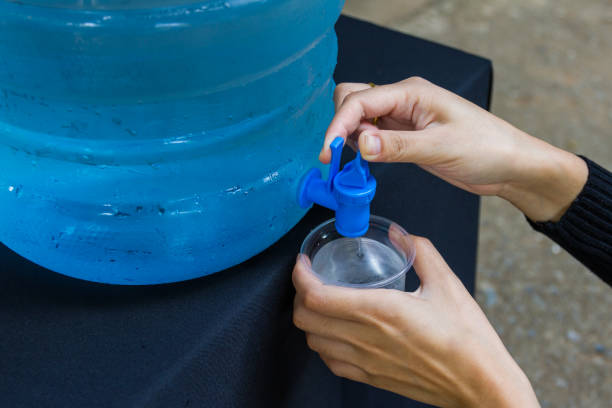 istock Female hand holding water glass 1268614067