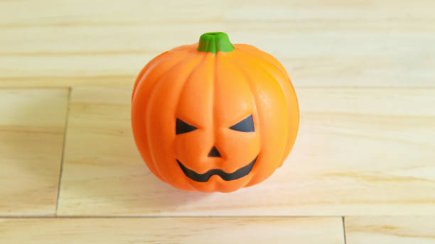 istock jack o lantern toy on  wood table for holiday content. 1268620185