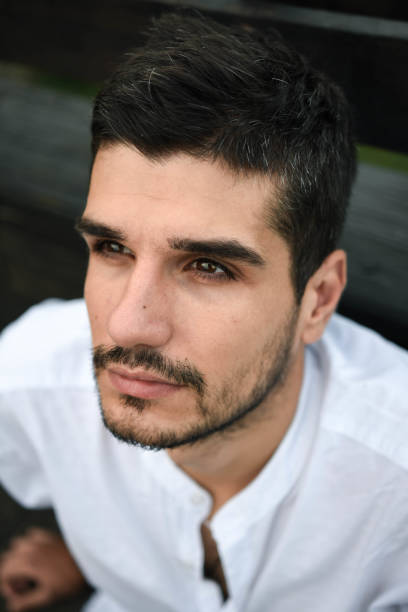 istock beautiful man looks into the distance 1268629039