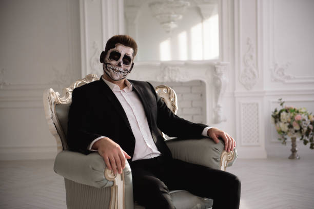 istock Man with a terrible make-up on white room background. 1268631048