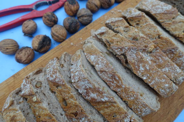 istock Walnut bread on on a wooden cutting board 1268631271