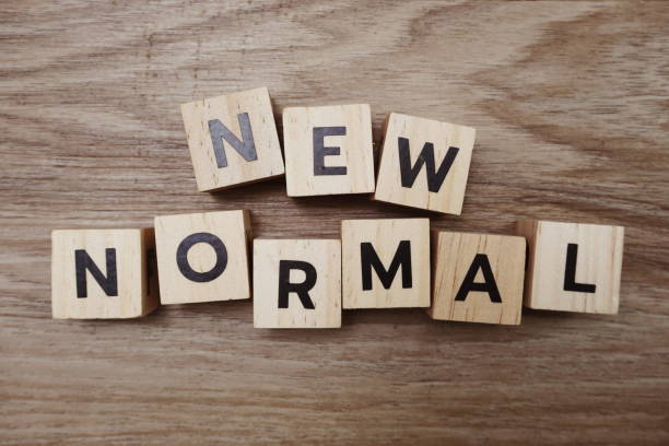 istock New Normal alphabet letters on wooden background 1268633804