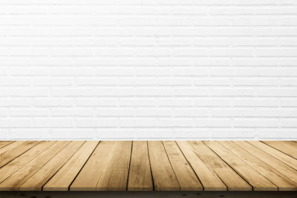 istock Empty wooden table top on white brick wall background, Design wood terrace white. Perspective for show space for your copy and branding. Can be used as product display montage. Vintage style concept. 1268633832