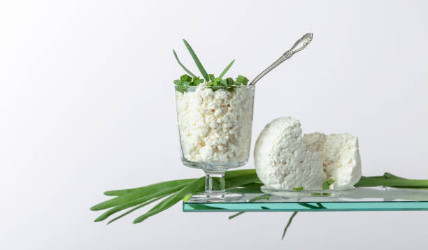 cottage cheese with green onion  in glass bowl on a white background. - 7298 imagens e fotografias de stock