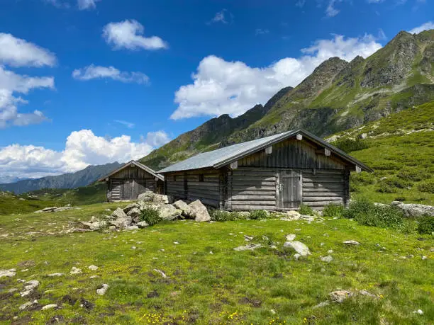 Old barns on the shore of the Lake Giglachsee in the Styrian Tauern - Austria. The place without  tourists after the coronavirus pandemic.