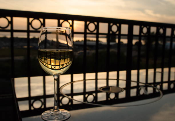 Glass of white wine at balcony near Blaine moorage, Washington Glass of white wine at balcony near Blaine moorage, Washington blaine washington stock pictures, royalty-free photos & images