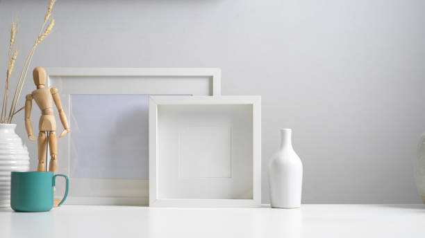 istock Modern home interior design with copy space, mock up frames, vases and decorations in white concept 1268640195